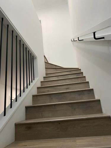 a staircase in a building with a stair railing at The Fitz in Wagga Wagga