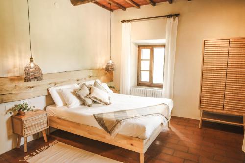 Postel nebo postele na pokoji v ubytování Sentire - Vegetarian Tuscan Villa & Resort