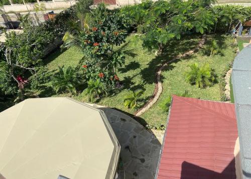 an overhead view of a garden with a roof at Barracuda House in Diani Beach