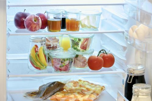 an open refrigerator filled with lots of fruits and vegetables at Die Alte Schmelz in Bad Dürkheim
