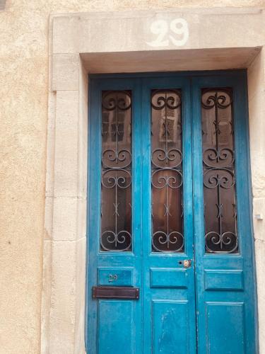 a blue door on a building with the number at Rent big room with breakfast free in old city in Nancy