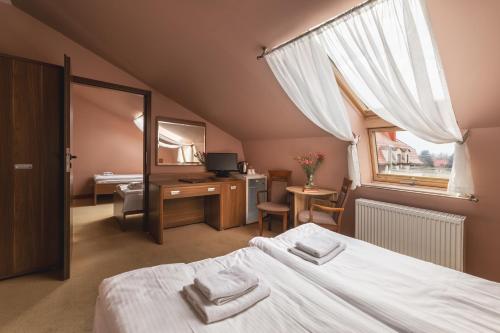 Posteľ alebo postele v izbe v ubytovaní Paria Hotel