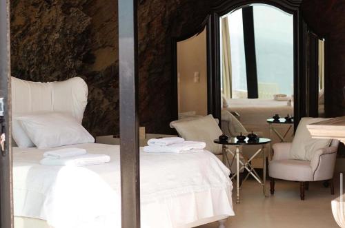 Ένα ή περισσότερα κρεβάτια σε δωμάτιο στο Villa Ariadne