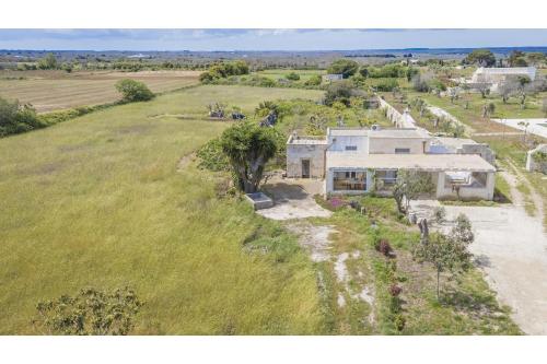 an aerial view of a house in a field at Villa La Reimunda in Otranto