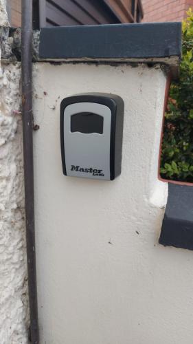 a black and white toaster on the side of a wall at Lovely Dublin Home - Just 15 Mins to City Centre in Dublin