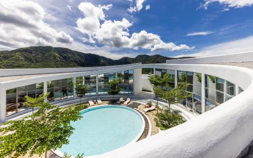 an aerial view of a building with a swimming pool at iSea Resort in Ba Ha