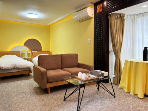 Postel nebo postele na pokoji v ubytování Rong Hua Grand Hotel 榮華グランドホテル