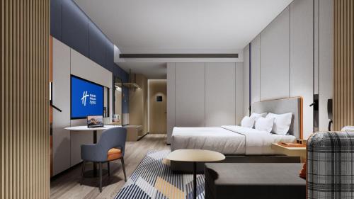 a hotel room with a bed and a desk at Holiday Inn Express Suzhou East Taihu by IHG in Suzhou