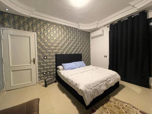 Ένα ή περισσότερα κρεβάτια σε δωμάτιο στο ستوديو ارضي مدخل خاص