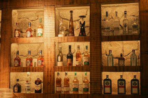 a display of bottles of alcohol on a wall at Sangam Farms in Bhilwara