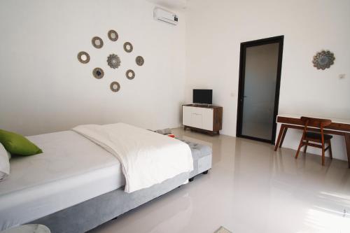 Кровать или кровати в номере The Valley Villa Senggigi