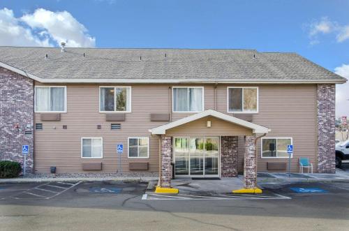 a house with a parking lot in front of it at Comfort Inn in Idaho Falls