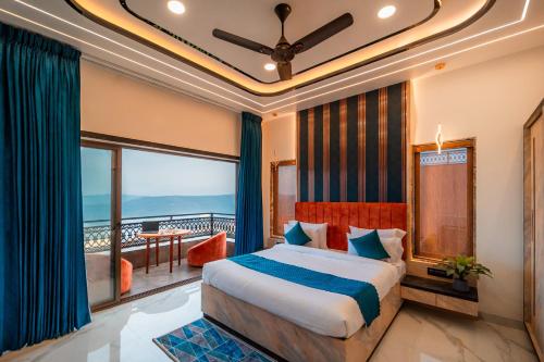 a bedroom with a bed and a balcony at Ghatjai Mansion2 in Panchgani