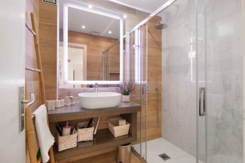 a bathroom with a sink and a shower at Luxury Sweet Homes T2 in Faro