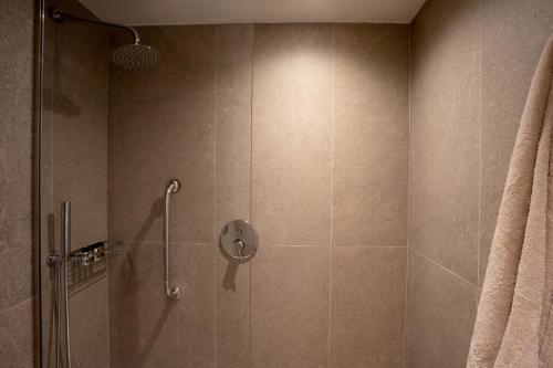 a shower with a glass door in a bathroom at KoSea Boutique Hotel in Kos Town