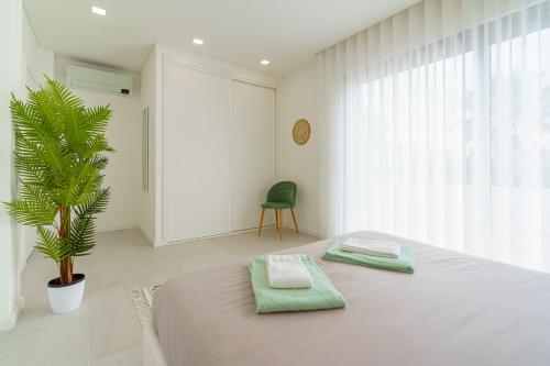 Ένα ή περισσότερα κρεβάτια σε δωμάτιο στο Villa Tropical