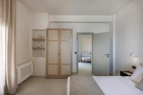 Ένα ή περισσότερα κρεβάτια σε δωμάτιο στο Morfes Luxury Suites by Caldera Houses
