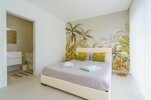 Ένα ή περισσότερα κρεβάτια σε δωμάτιο στο Villa Tropical