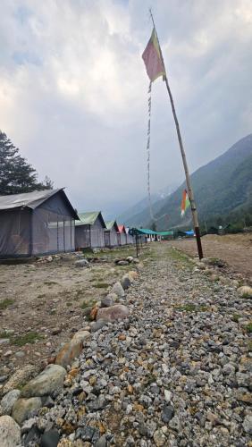 a kite on a pole on a rocky ground at Sangla Valley Camping in Saturang