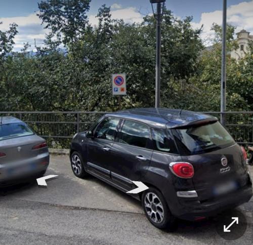 a small car is parked in a parking lot at Casa Ofelia in Colledimezzo