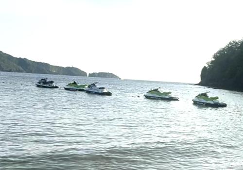 a group of boats in a large body of water at Sunset Room at Pico - Hamilo Coast Pico De Loro in Nasugbu