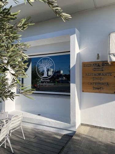 a sign on the wall of a restaurant at Hacienda Guadalquivir in Córdoba