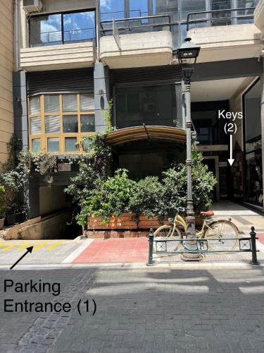 a bike parked next to a street light in front of a building at Central loft D5 in Volos