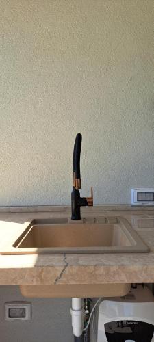a kitchen sink with a wooden counter top at Villa Stone - Pool house 100 meters from the beach in Vinišće