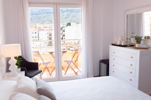 Una cama o camas en una habitación de Hostal Comercio
