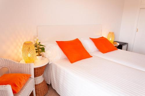 Una cama o camas en una habitación de Hostal Comercio