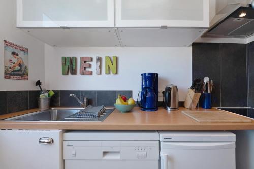 a kitchen with a sink and a counter top at Ferienwohnung Bachem in Bad Neuenahr-Ahrweiler