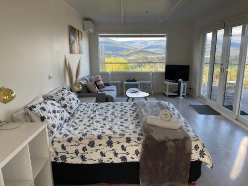 a living room with a bed and a couch at Beauty of Healesville in Healesville