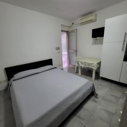Ένα ή περισσότερα κρεβάτια σε δωμάτιο στο Residence Dolce Far Niente