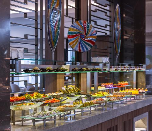 a buffet line with many different types of food at Narven Wellness & Thermal Hotel in Yukarımahalle