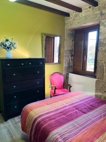 Postel nebo postele na pokoji v ubytování Casa de Calaza