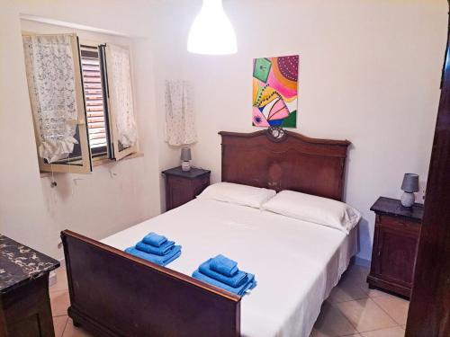 a bedroom with a bed with two towels on it at Casa dei Trabocchi 2-3 in San Vito Chietino