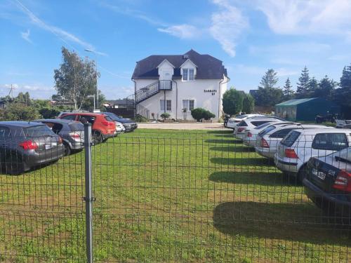 a bunch of cars parked in a parking lot at DAGMARA in Łeba