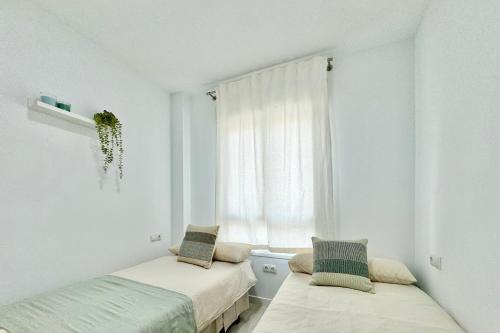 Apartamento en 1ª línea de playa, piscina y parking