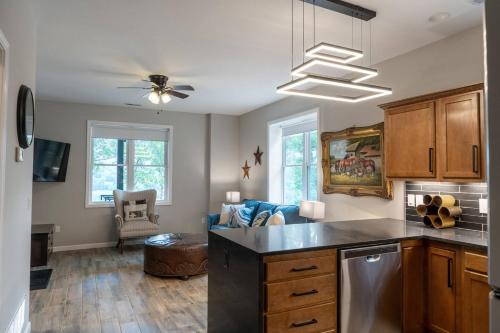 a kitchen with a counter top and a living room at Jesse James and Billy the kid in Hermann