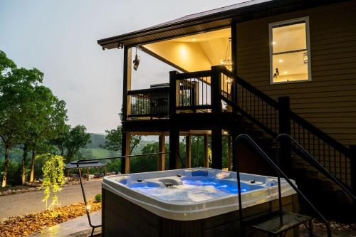 a hot tub on the side of a house at Bonnie n Clyde and Jesse James in Hermann