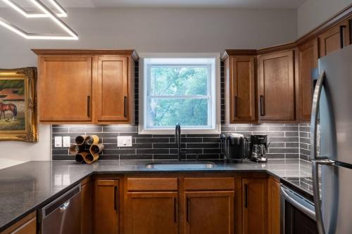 a kitchen with a sink and a window at Entire Hermann Hideout in Hermann