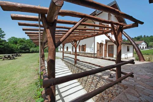 a wooden fence in front of a building at Ant Ra Prina Verde in Sassello