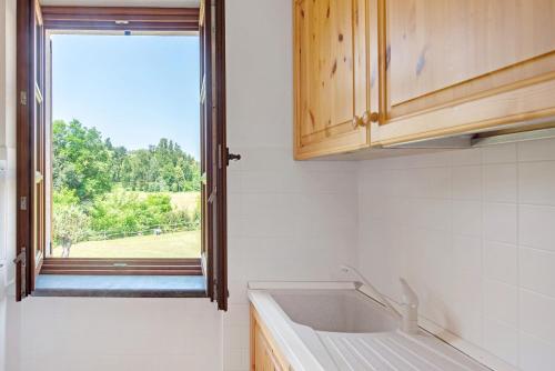 a kitchen with a sink and a window at Ant Ra Prina Chiaro Pino in Sassello