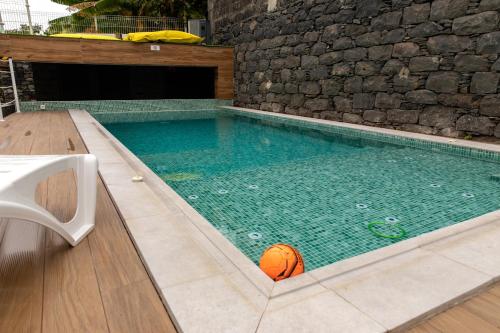 a basketball in a swimming pool with a basketball in it at HOMELIKE FUNCHAL I in Funchal