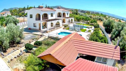 an aerial view of a house with a swimming pool at Limone Villas No 3 in Argaka