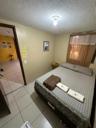 Una cama o camas en una habitación de RioSlz Hostel