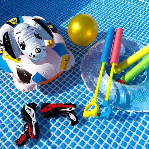 a toy cow on a table with pens and scissors at 杷木松末アウトドアヴィレッジ in Asakura