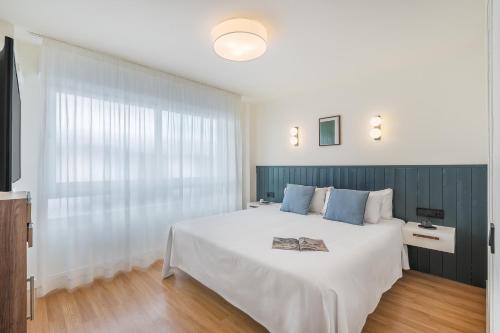 Postel nebo postele na pokoji v ubytování Granada Suites by Olala Homes