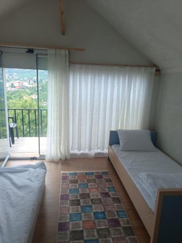 Postel nebo postele na pokoji v ubytování Çatalkaya Bungolov