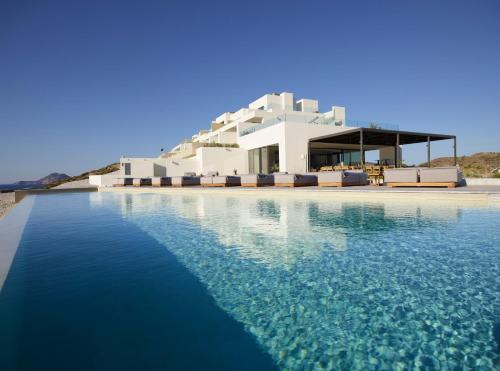 a rendering of a house with a swimming pool at Domes White Coast Milos, Adults Only - Small Luxury Hotels of the World in Mytakas